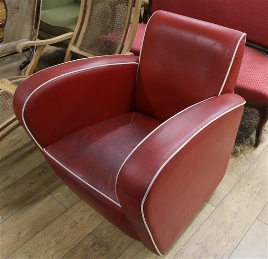 A 1960s red leather club armchair